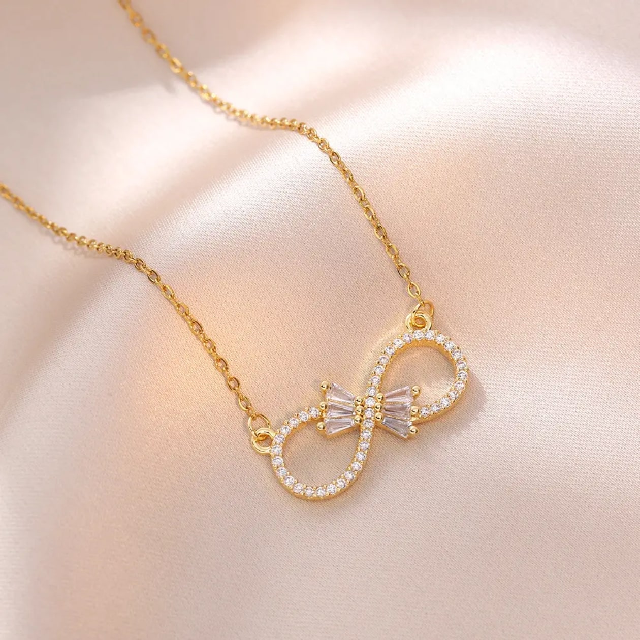 Infinity Bloom – Zircon Bow Necklace