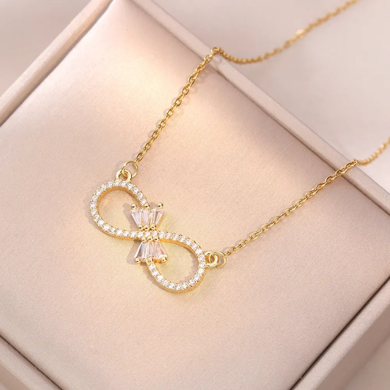 Infinity Bloom – Zircon Bow Necklace